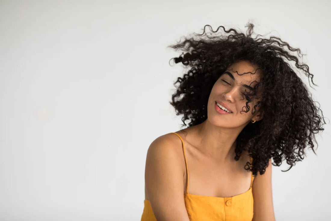 How To Restore Your Natural Curl Pattern, According To Experts